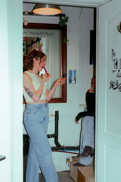 A person standing by the window during a Coterie studio session.